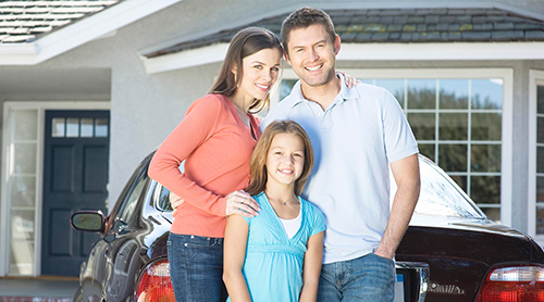 Family of four at the front of their house - Free Insurance Quotes in Oklahoma City, OK 73170